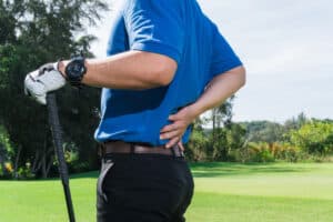 Golfer has pain in his back spine during his weekly game on the greens.